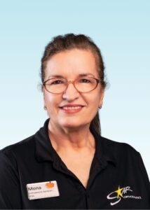 Mona, Orthodontic Assistant RDA, smiling in a black polo shirt