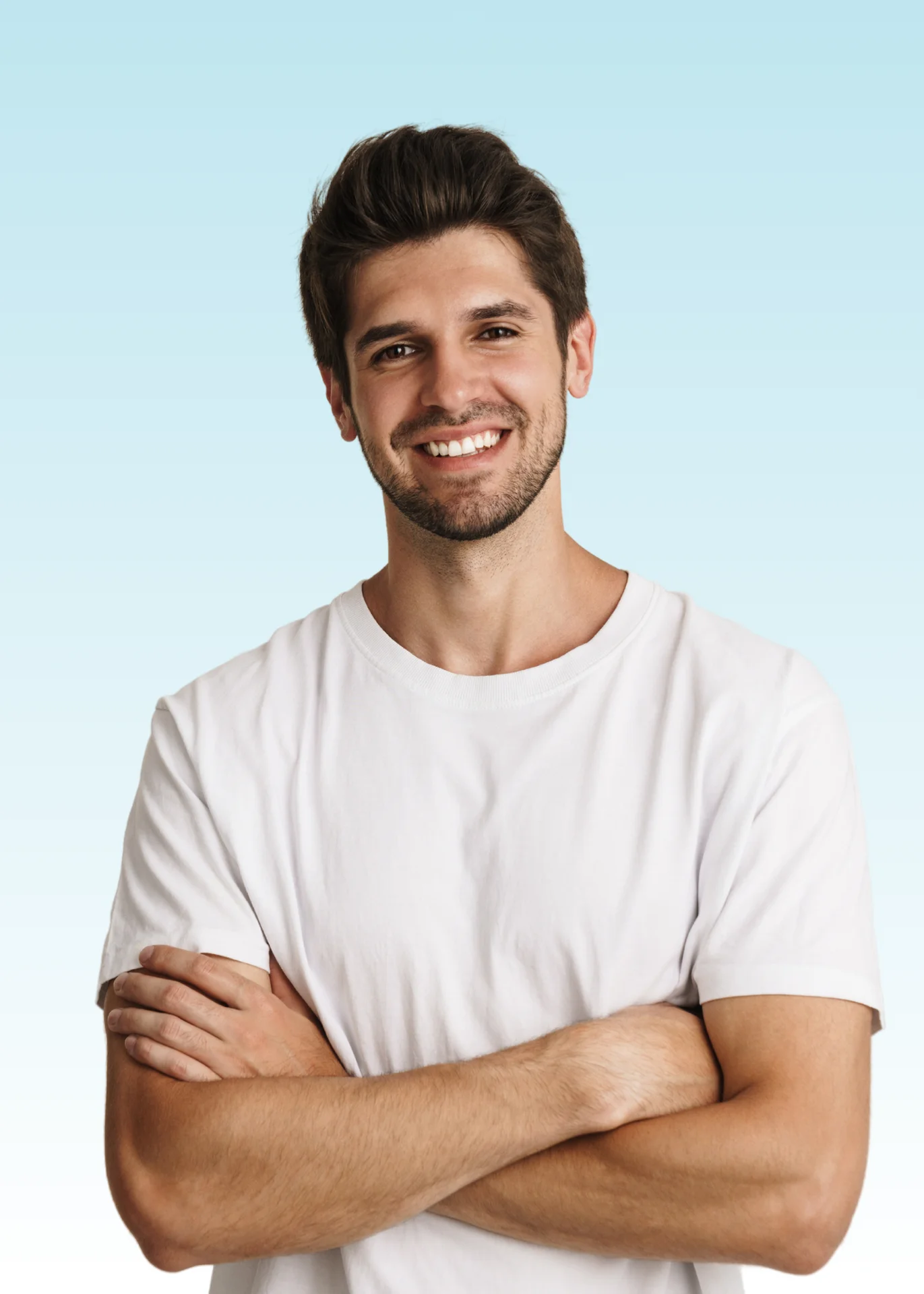 Smiling young man with arms crossed in a white t-shirt showing straight white teeth