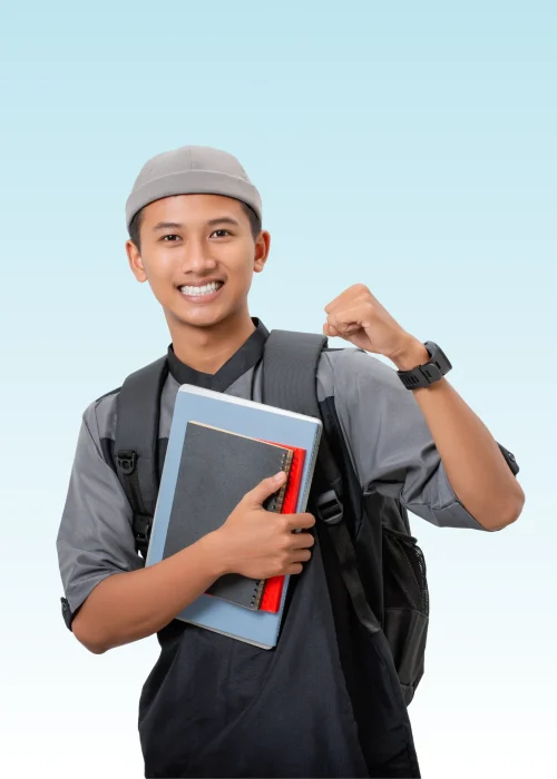 Smiling teen with backpack and books raising fist in confident pose